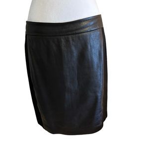 Loft black leather mini skirt with knit/tricot side panel.
